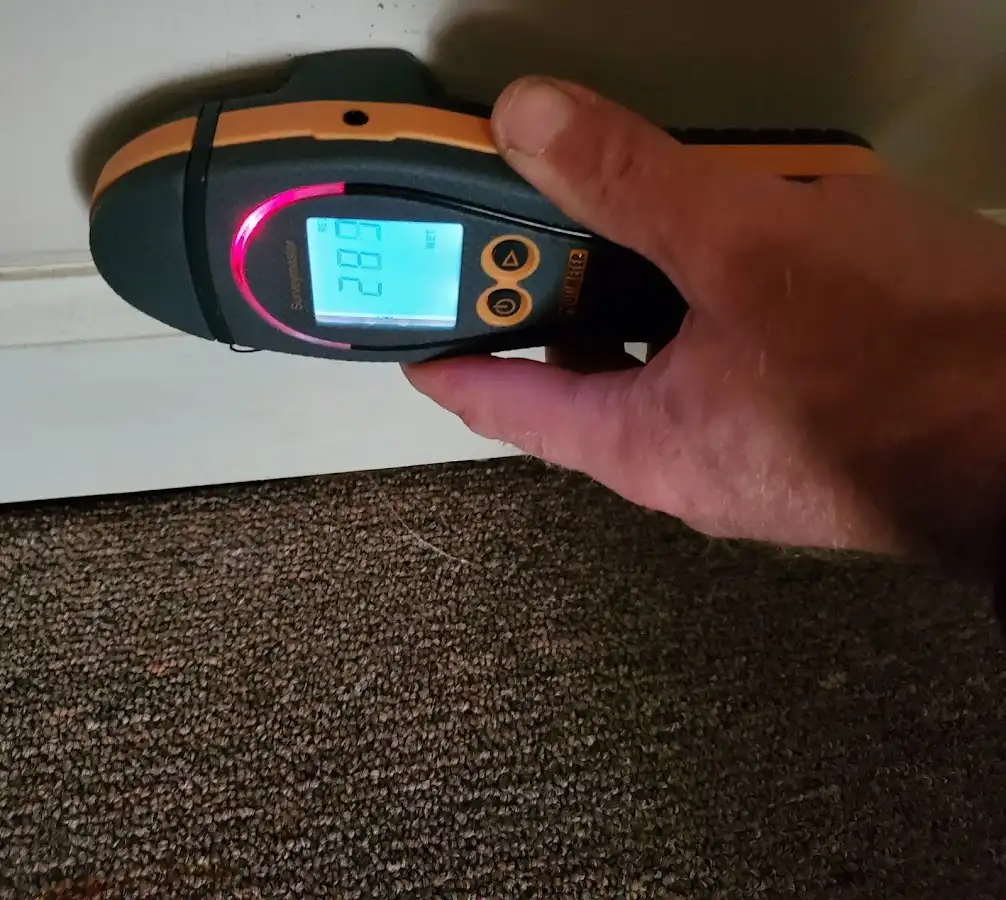 Moisture detection at baseboard during Storm Damage Restoration in Palm Springs